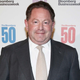 Bobby Kotick wearing a black suit and white tie.